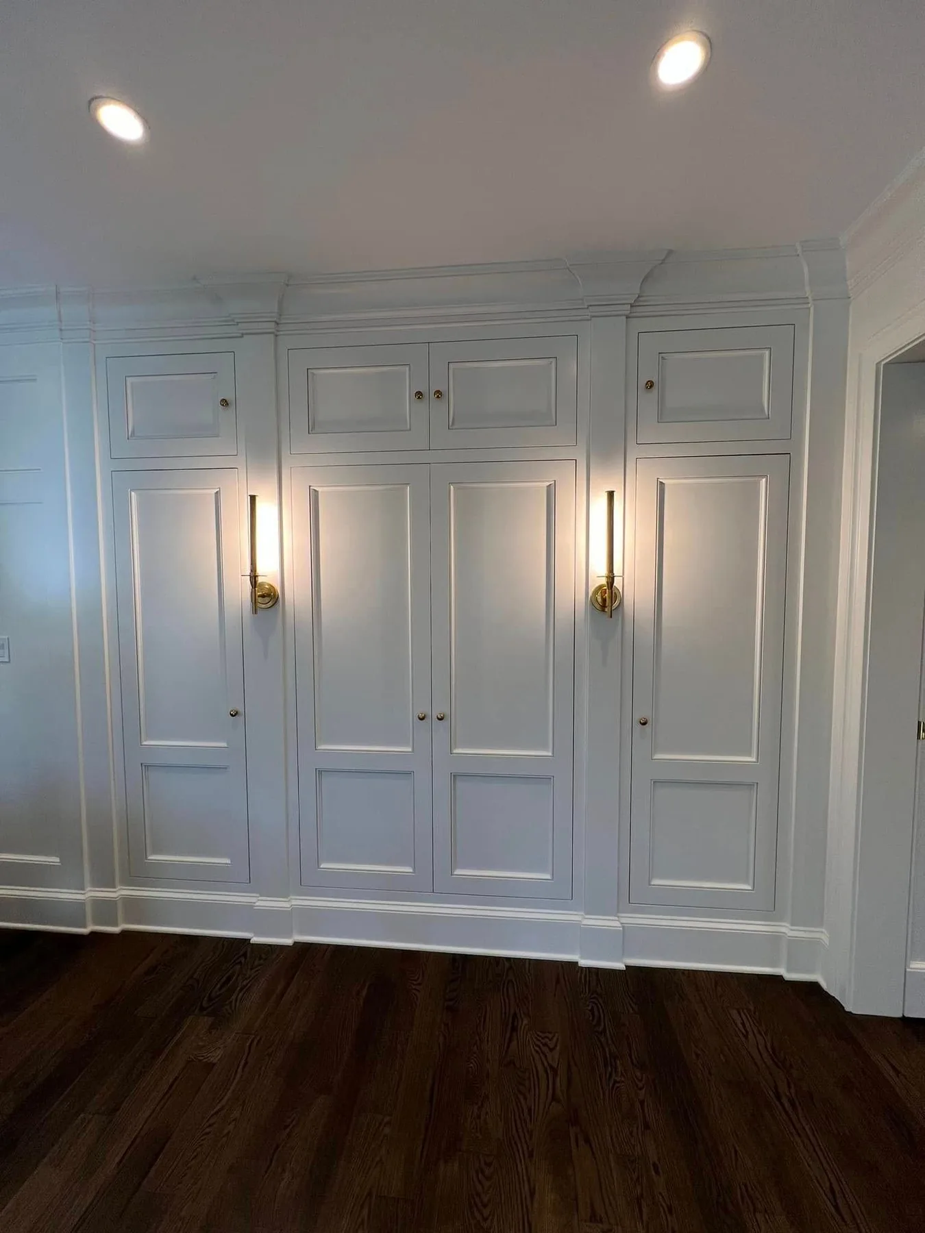 Floor to ceiling white paneled pantry cabinetry